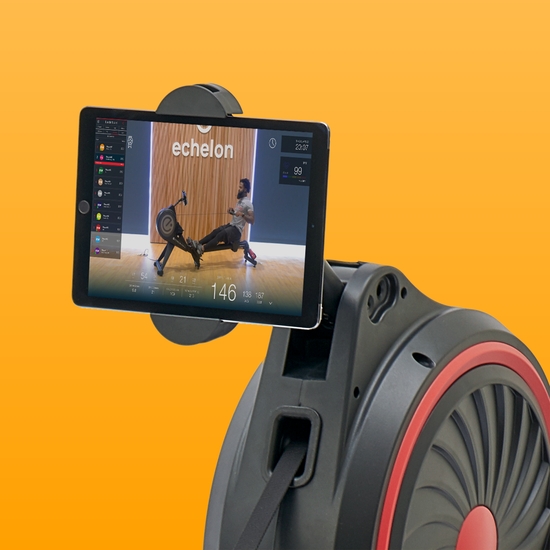 Row is equipped with smart device holder that flips for off-equipment workouts. Tablet is not included.